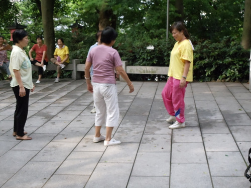 Ladies playing Shuttle-Cock.